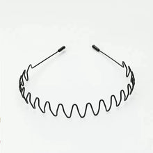 Metal headband non slip elastic wavy black design flat lay view.