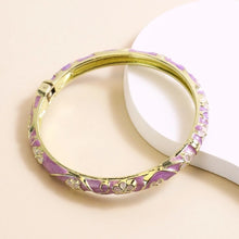 Flower enamel bracelet worn on wrist showing vibrant colour finish.