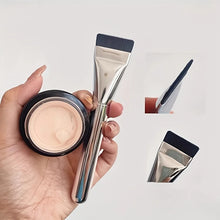 Oval foundation brush ergonomic shape for face contouring and blending.