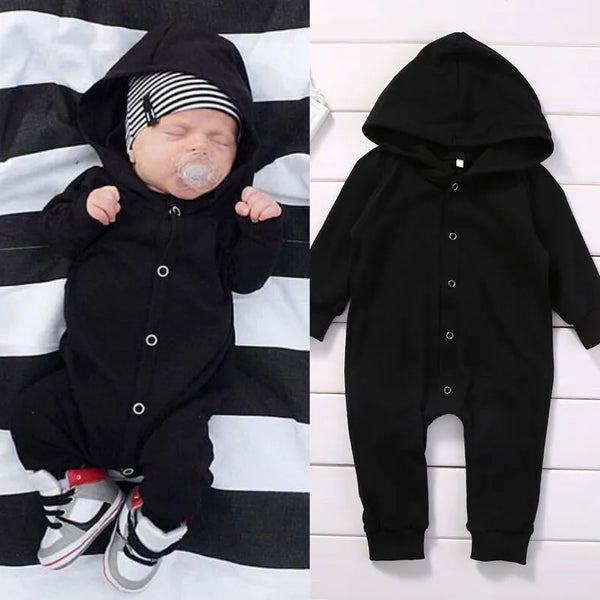 Black baby romper worn by a baby boy
