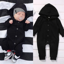 Black baby romper worn by a baby boy